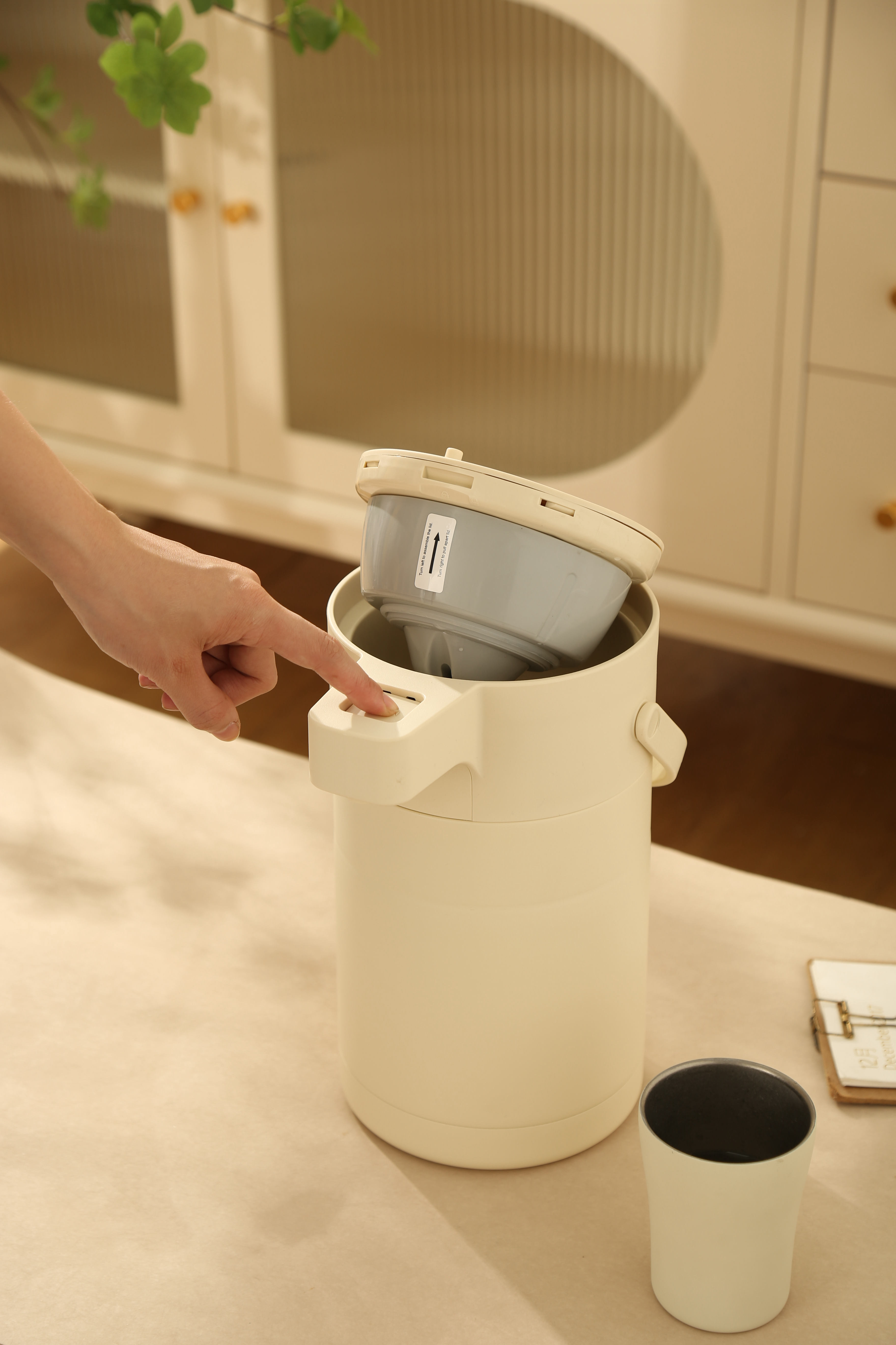 2.5L Air Pressure Kettle in Black/White, minimalist thermal insulated water dispenser with air-pressure spout and ergonomic handle, ideal for home/office