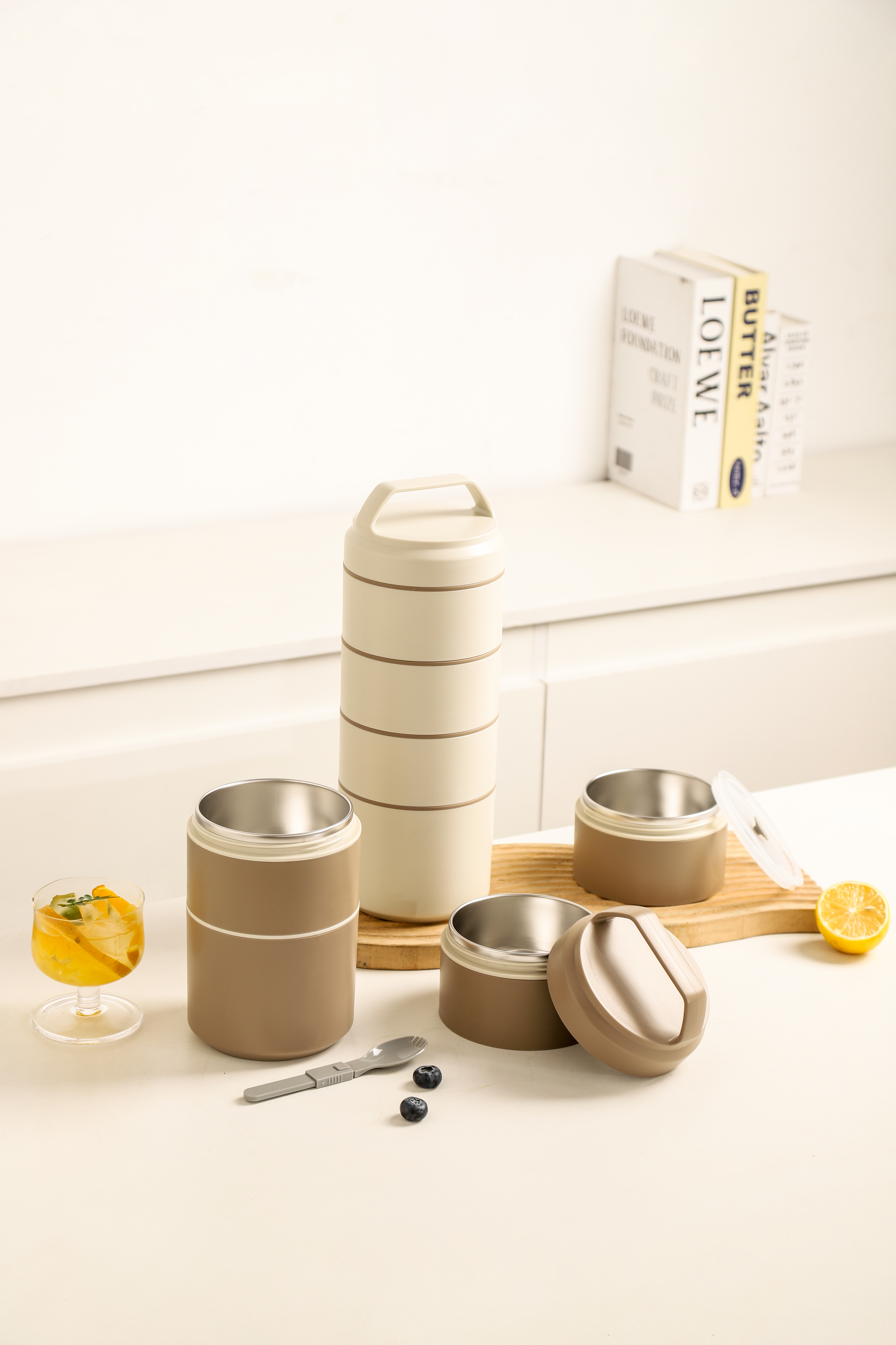 Beige and Khaki stainless steel insulated food jar set with stackable containers, airtight lids, and a folding spoon