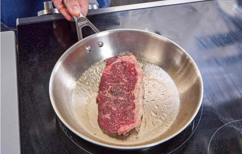 Frying meat in stainless steel pans