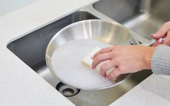 Use a soft sponge to clean stainless steel pans